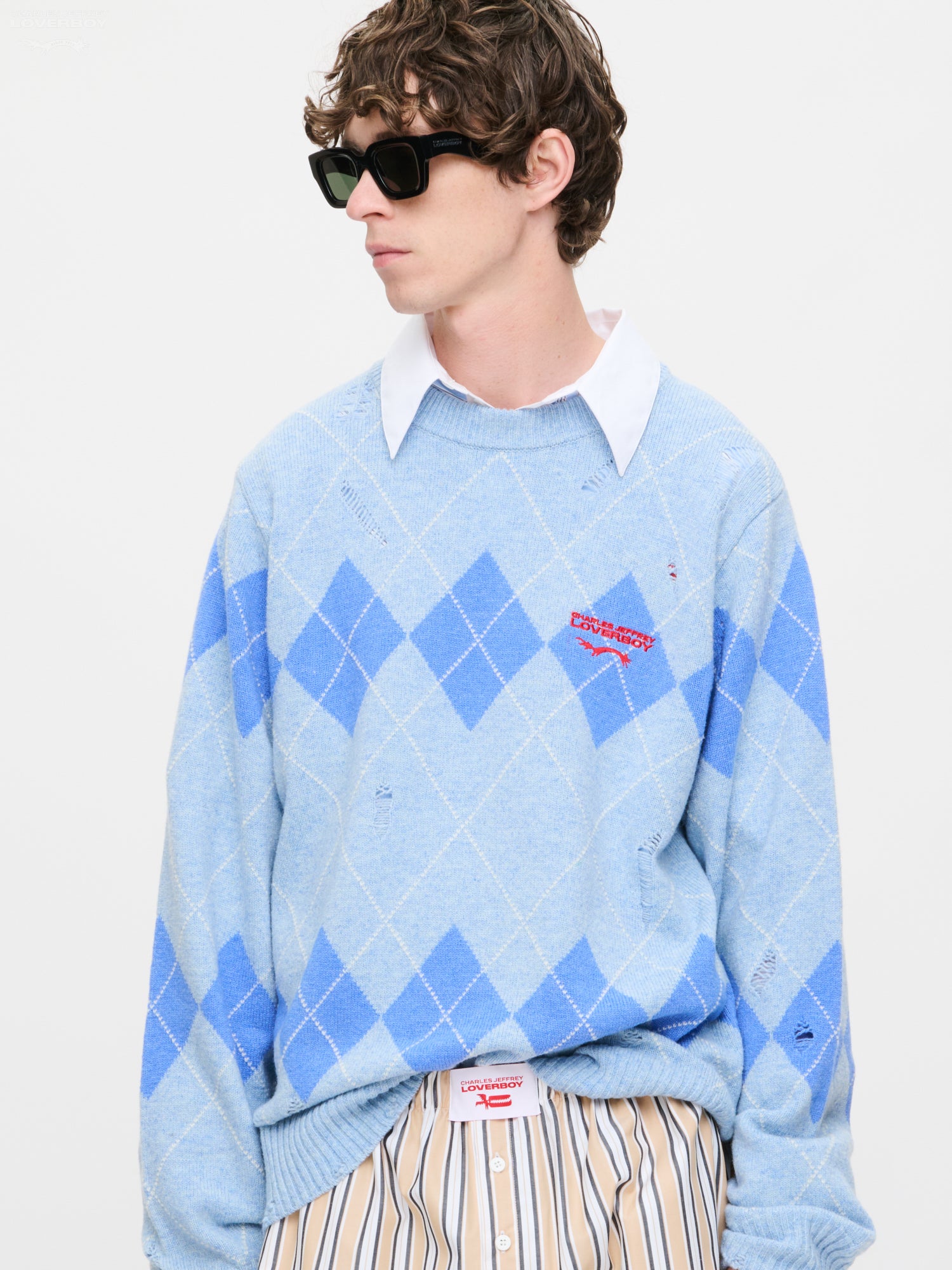 DISTRESSED ARGYLE SWEATER in LIGHT BLUE
